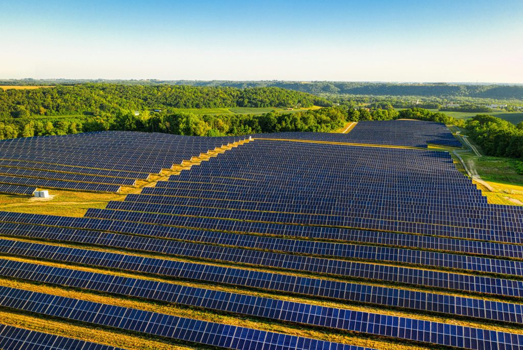 Aerial view of a vast solar farm in Red Wing, MN, generating renewable energy.